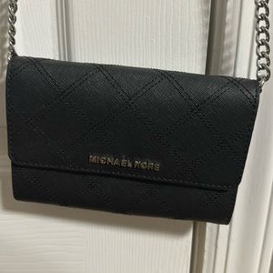 Michael Kors black crossbody wallet chain bag.